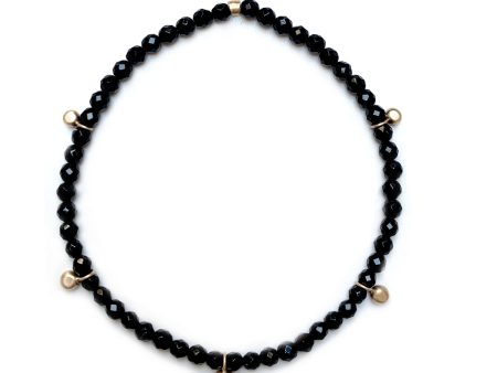 Gold bead charm stretch bracelet with black onyx faceted beads Online Sale